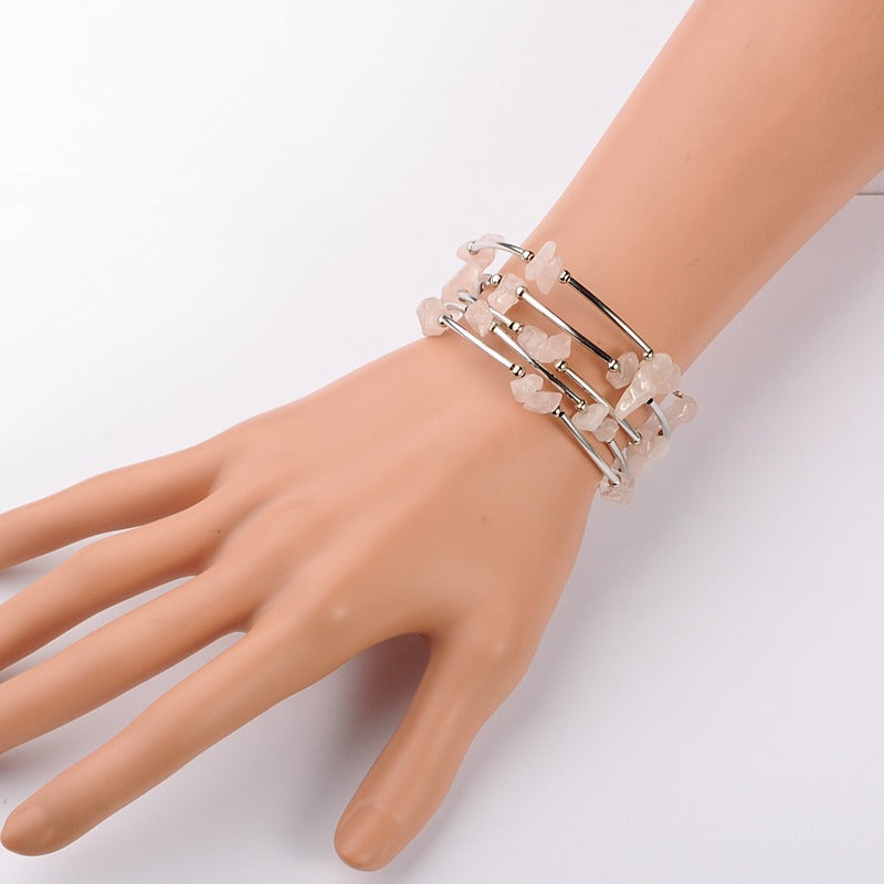 A Maramalive™ mannequin's hand with a Women's Natural Crystal Crushed Stone Bracelet.