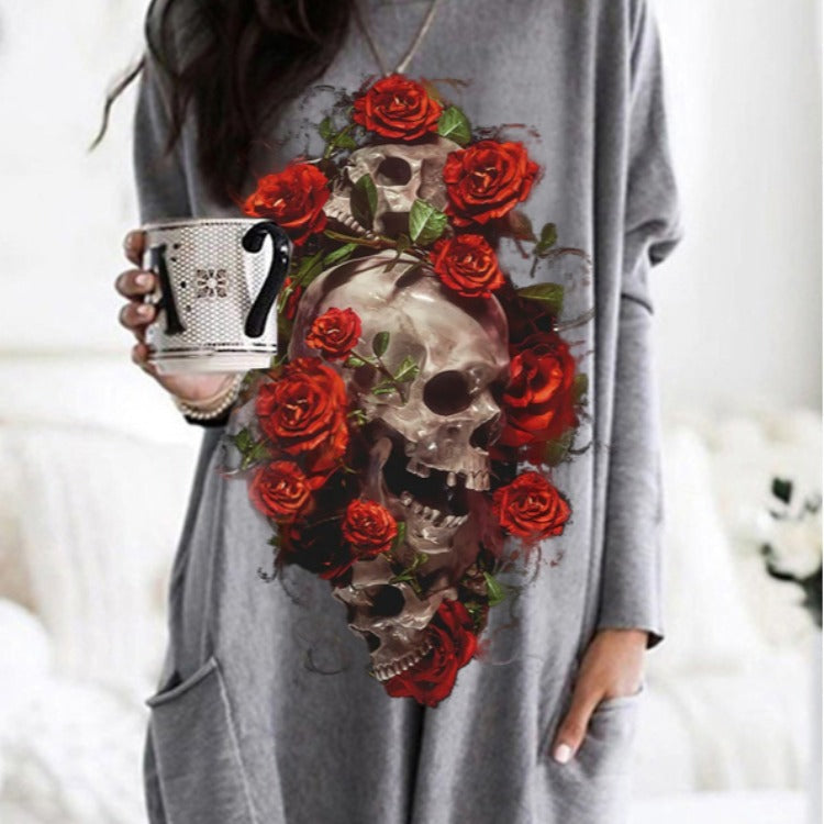 A woman wearing a gray dress with the Maramalive™ Halloween Skull Rose Print Pattern Long Sleeve on it.