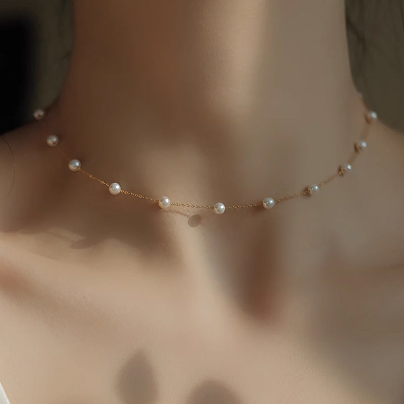 A woman wearing a Starry Natural Freshwater Pearl Necklace by Maramalive™.