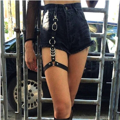 A woman wearing a pair of Personality Punk Fashion Gothic Style Women's Leggings Chain shorts and a belt, by Maramalive™.