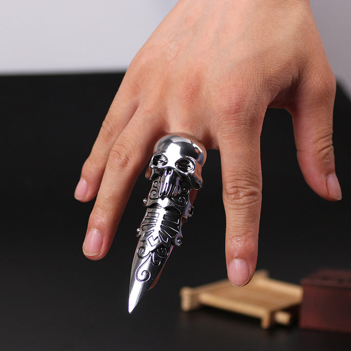 A person holding a Dragon Ring Alpha Male Punk Street Men's Ring by Maramalive™ with a skull on it.