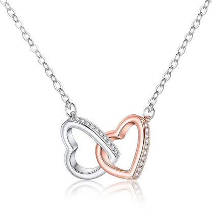 A gift box with a Rose Gold Necklace Hearts Ladies' Pendant by Maramalive™ and a hat.
