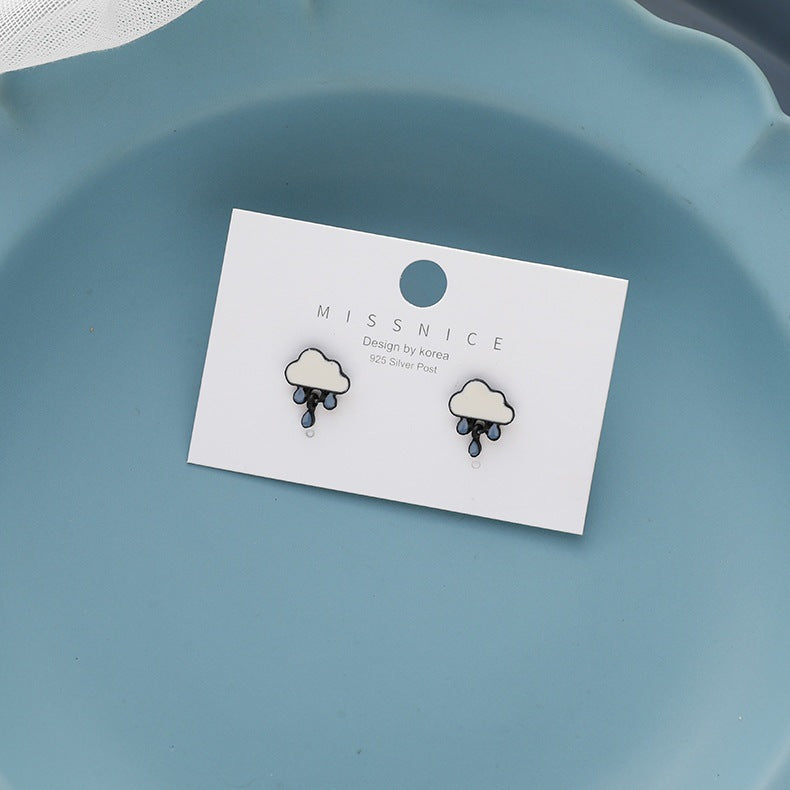 Graceful Cute Stud Earrings by Maramalive™ on a blue plate.