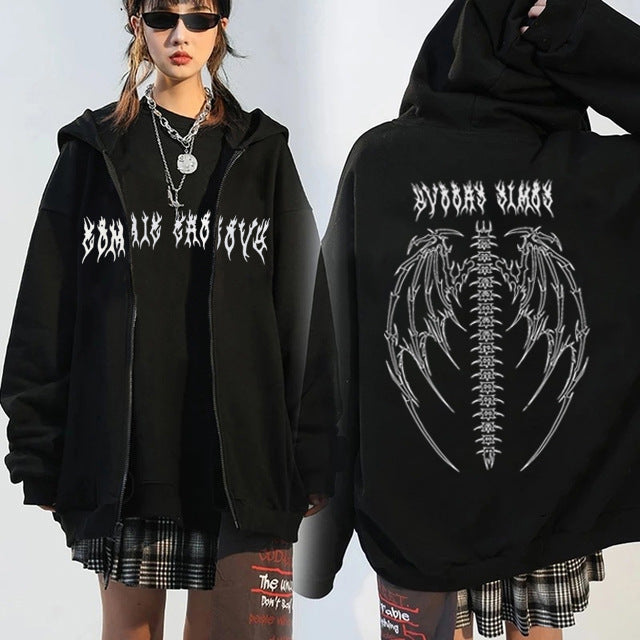 A person wearing a black Maramalive™ Comfy Zipper Hoodie for Fall: Hooded Sweatshirt & Sweater with white gothic text and graphic designs on the front and back. The front text reads "DEAD INSIDE," while the back features a skeletal design with bat wings. This versatile sweater makes an ideal autumn companion, blending style and comfort seamlessly.