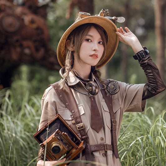 A girl in a hat holding a Maramalive™ Steampunk Summer Artifact Hanging Neck Three-speed Double USB Travel Mini Fan in the grass.