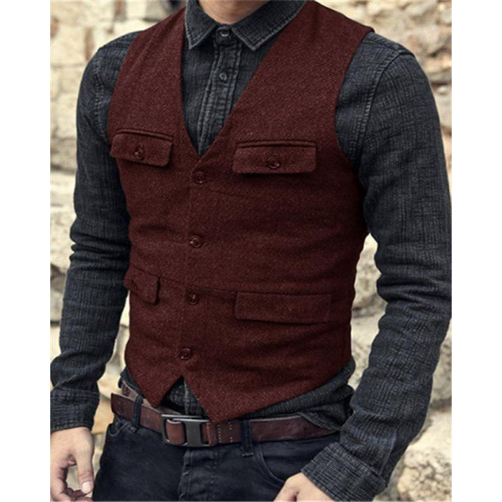 A person wearing a dark grey collared shirt with jeans and a Maramalive™ European And American Men's Vest Casual Solid Color Herringbone Vest, embodying British style fashion, stands outdoors.