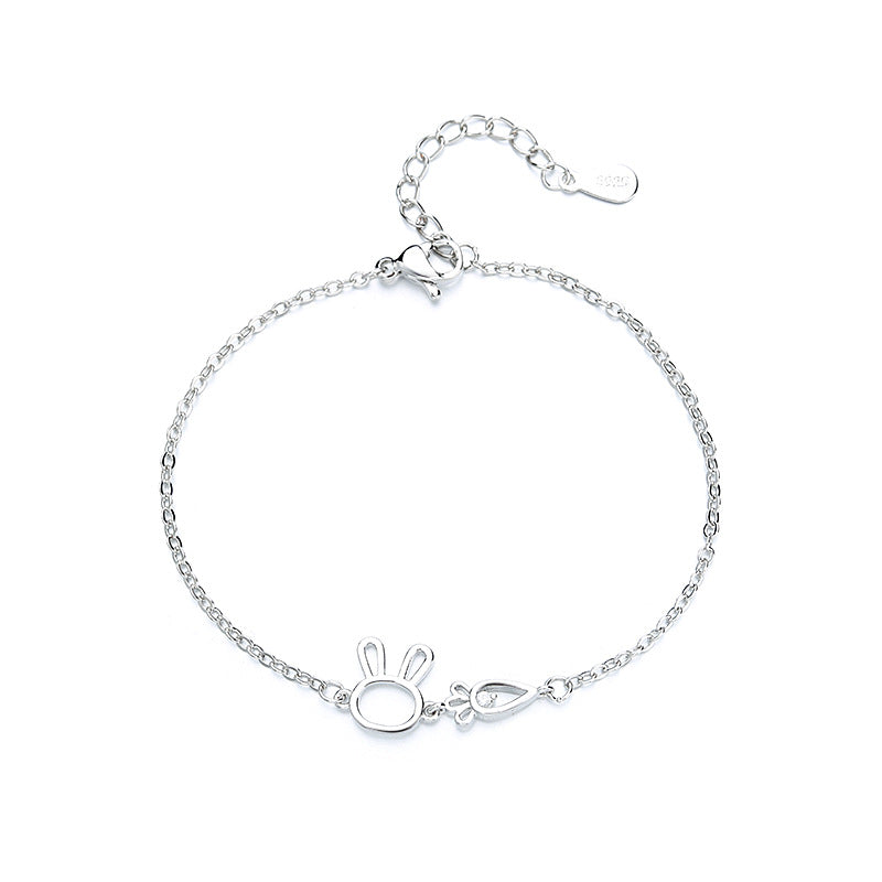 A woman wearing a Maramalive™ Minimalist Sparkling Diamond Bracelet with an initial on it.