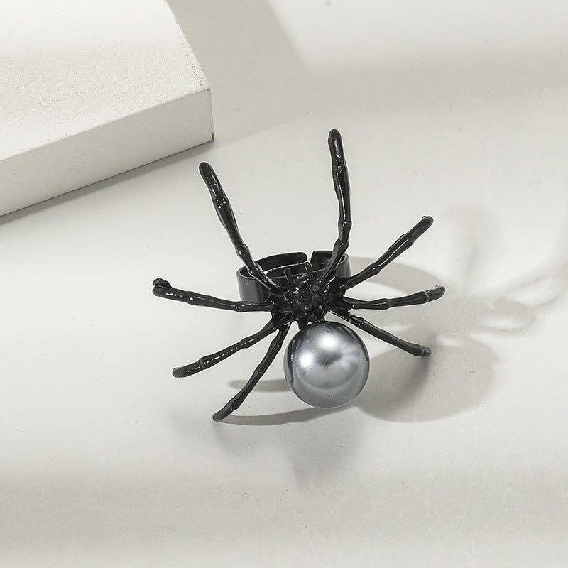 A woman's hand is holding a Spider Silver Ring: Halloween Fashion by Maramalive™.