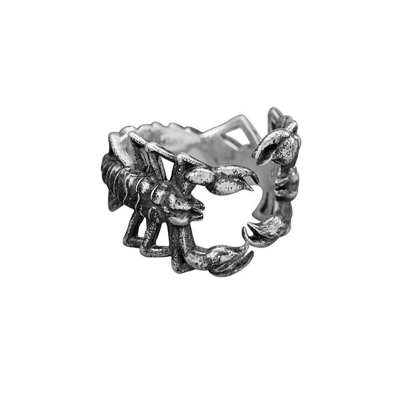 A person holding a Maramalive™ Silver Scorpion Ring.