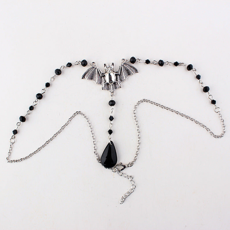 A Gothic Bat Necklace with a bat on it by Maramalive™.