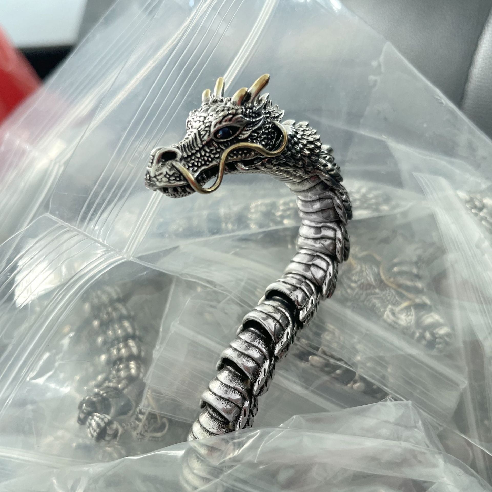 A Maramalive™ Unique Punk and Steampunk Style Sapphire Zodiac Dragon Bracelet with a dragon head on it.