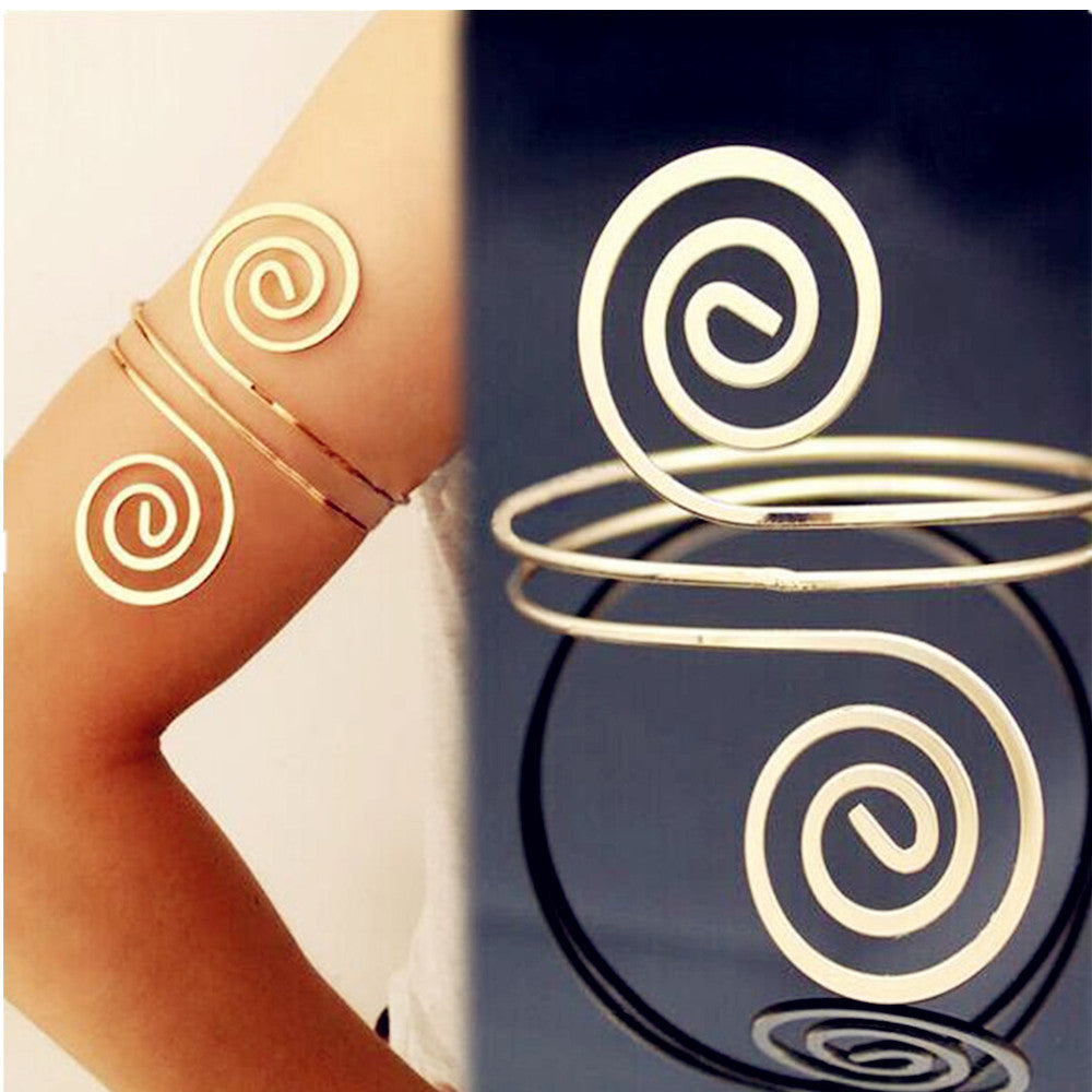 A woman's arm with an Eye-Catching Arm Ring Bracelet from Maramalive™.
