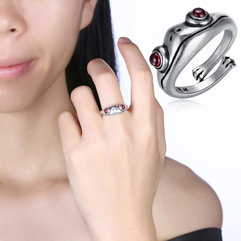 A Maramalive™ Garnet Frog Adjustable Ring with red stones.
