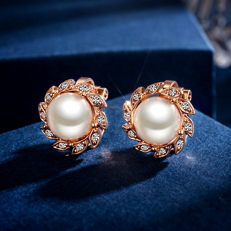 A pair of Maramalive™ Pearl Ear Clip for Women earrings in rose gold.