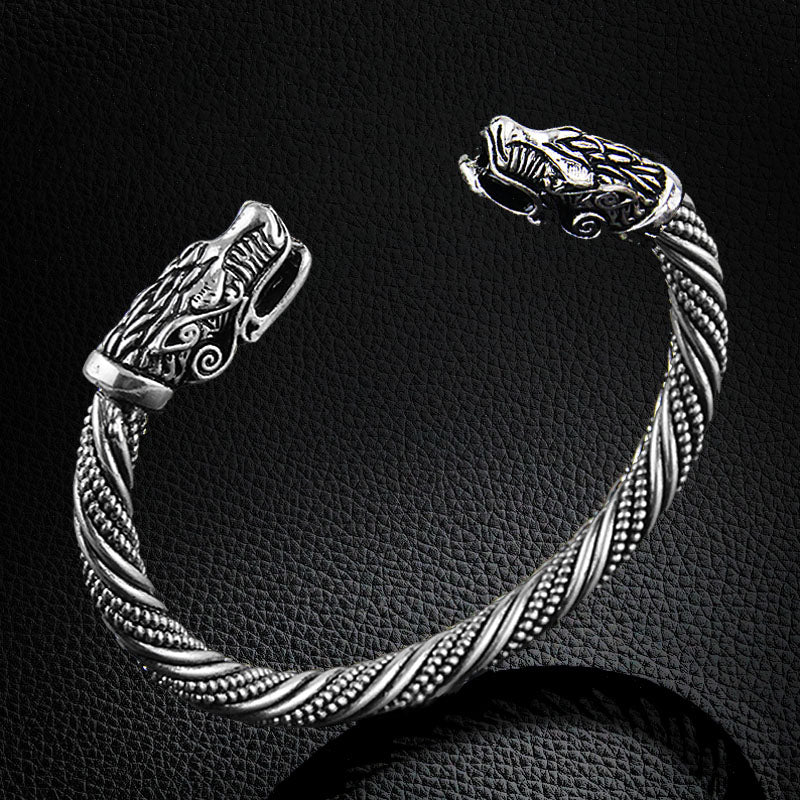 A close up of a Maramalive™ Viking Rune Dragon Bracelet on a table.
