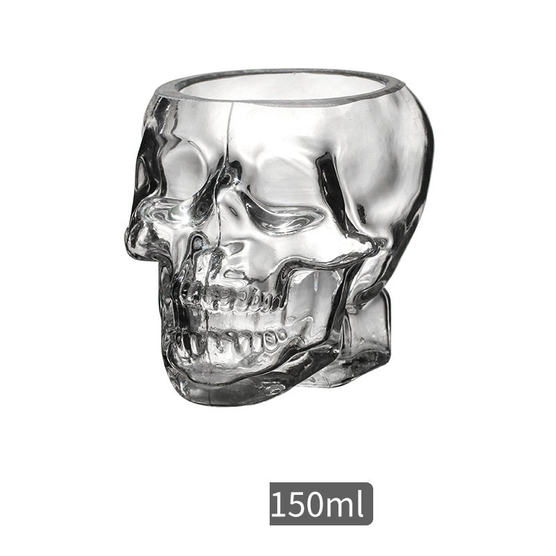 A glass of water is being poured into a Maramalive™ Skull Spirit Glass.