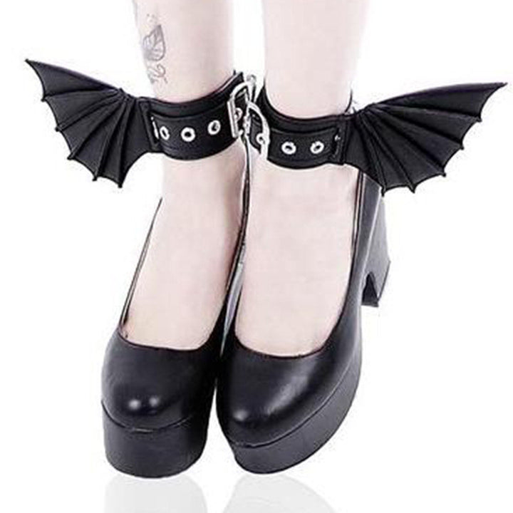 A woman donning Midnight Magic: Fashion Gothic Dark Wind Bat Wings Hand And Foot Accessories with bat wings, adding a touch of gothic glam to her attire. (Brand Name: Maramalive™)