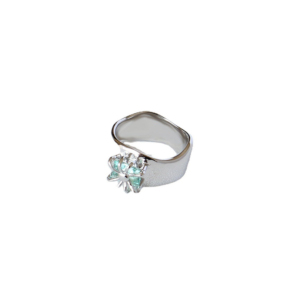 A Cold Wind Couple Ring with a green stone in the middle by Maramalive™.