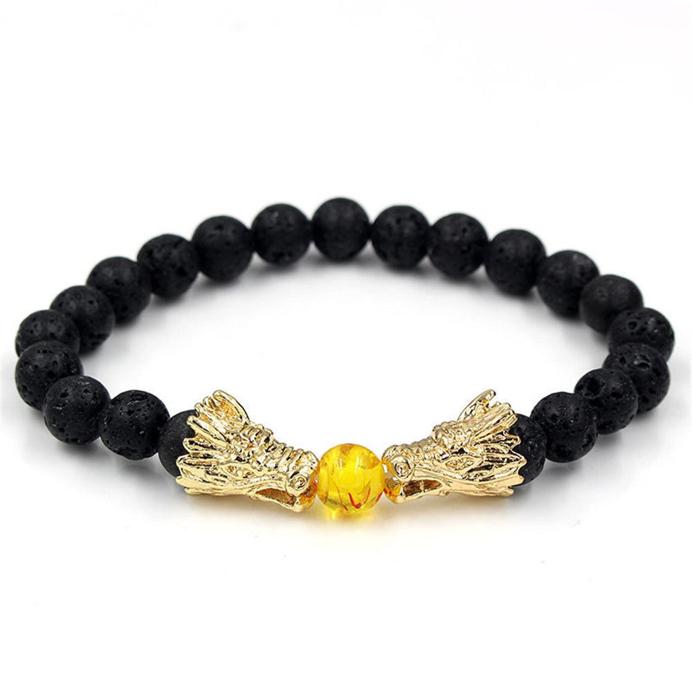 A gold Maramalive™ dragon head bracelet with yellow lava beads.