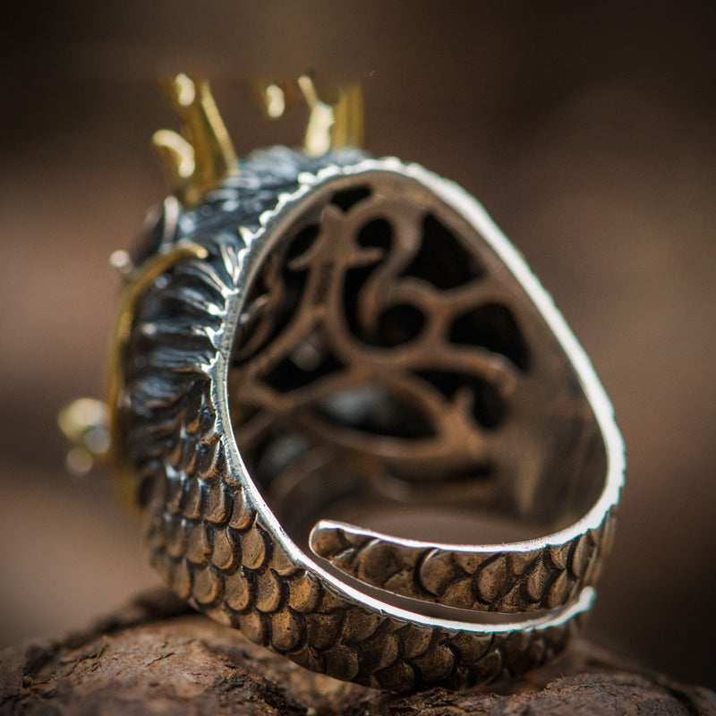 A person wearing a Maramalive™ handmade dragon ring.