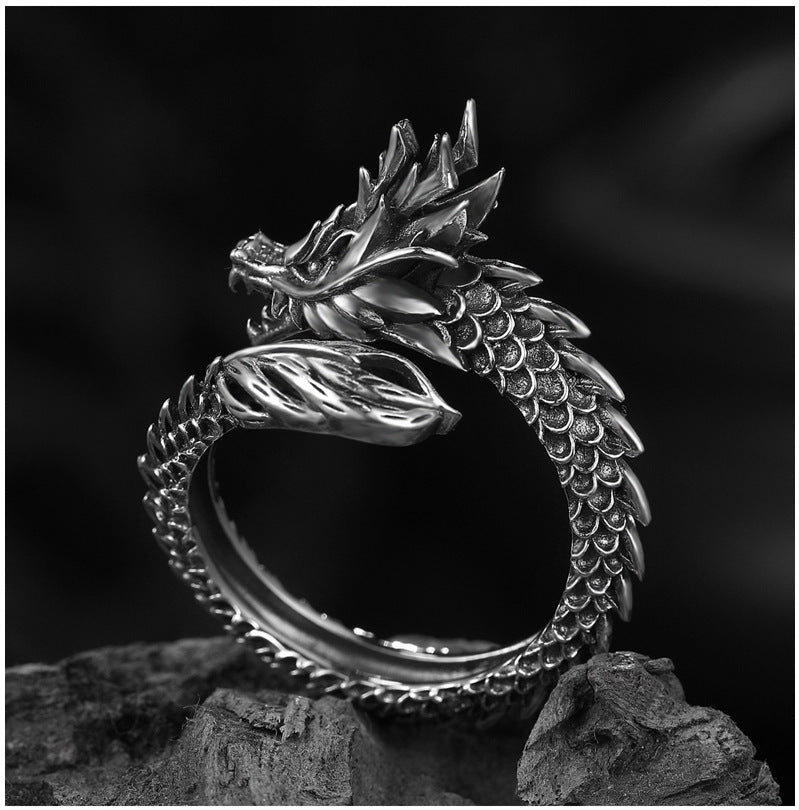 A black and white photo of a Maramalive™ silver Dragon Ring.