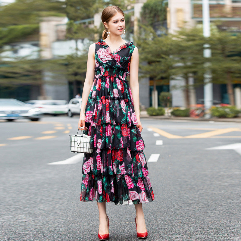 A black and pink Rose print princess dress by Maramalive™ hangs on a hanger.