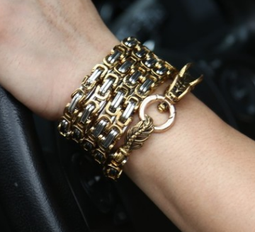 A woman wearing a Maramalive™ This Dragon Bracelet chain in a car.