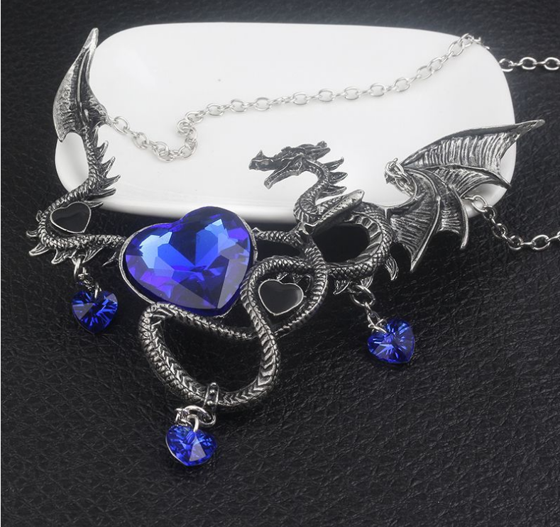 A Maramalive™ heart-shaped sapphire dragon necklace on a mannequin.