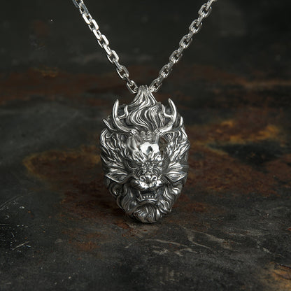 A silver necklace with a Maramalive™ S999 Dragon Head Pendant on it.