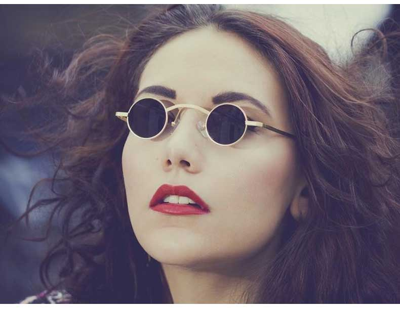 A woman wearing Maramalive™ round sunglasses with red lipstick.