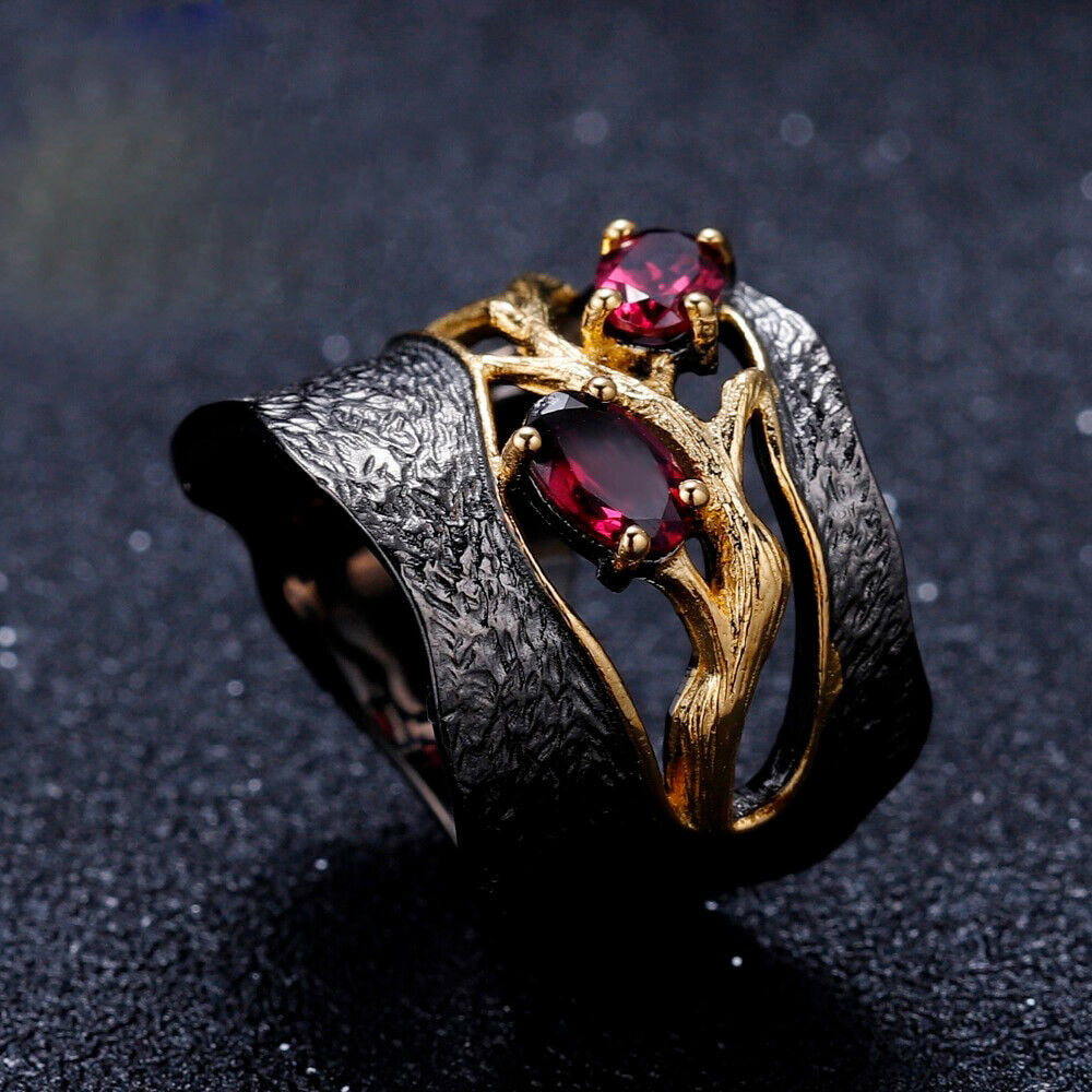 A black and gold Garnet Ring with a garnet stone by Maramalive™.