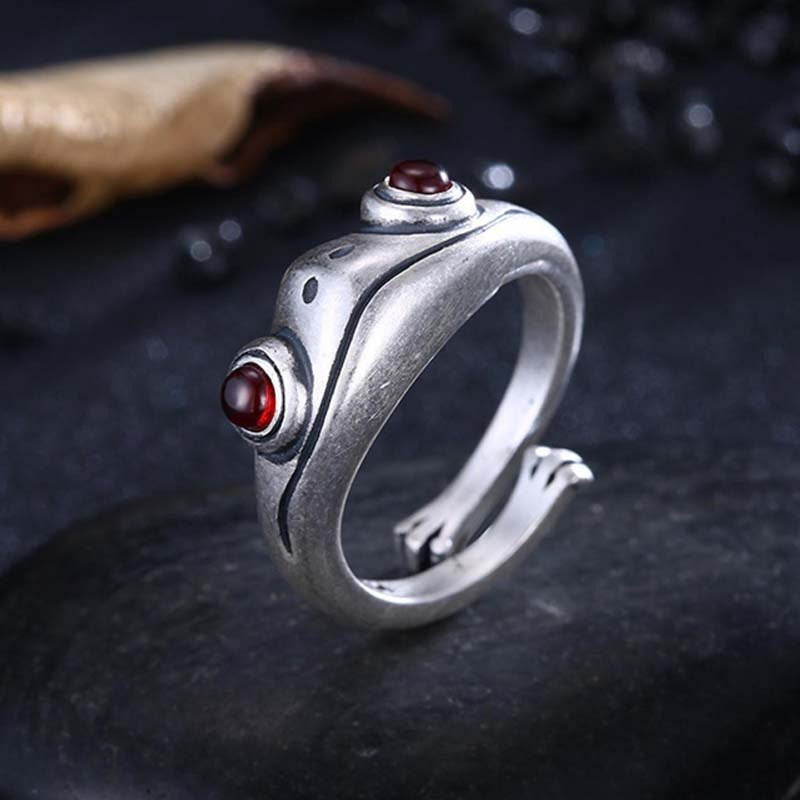 A Maramalive™ Garnet Frog Adjustable Ring with red stones.