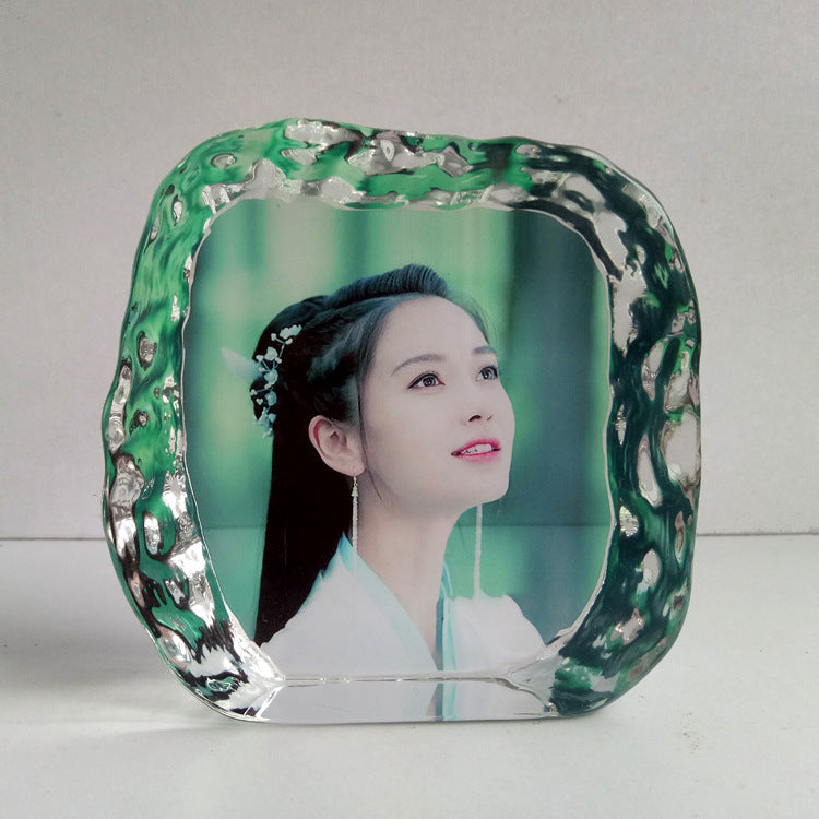 A Maramalive™ glass photo frame with a woman's face on it.