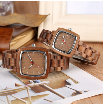 Two Bamboo Watches by Maramalive™ on a wooden table.