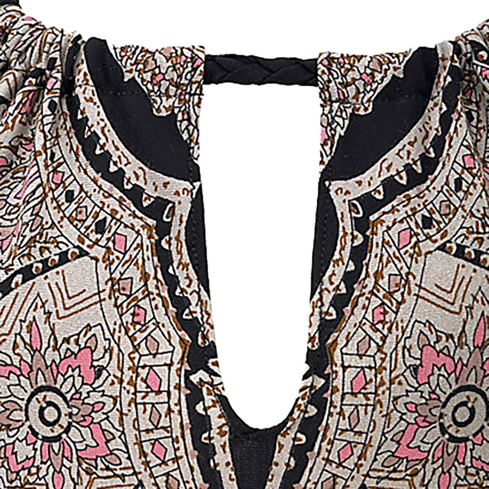 The Maramalive™ Dress beach skirt showcases a sophisticated black paisley print, beautifully adorning the woman's back view.