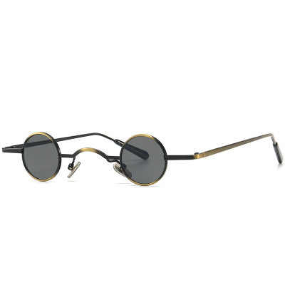 A pair of Maramalive™ Steampunk Sunglasses with gold rims.