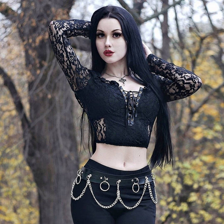 A Maramalive™ Gothic Lace Bandage Top Black Retro Sexy Perspective Long Sleeve T-Shirt-wearing woman posing for a photo with a street hipster vibe.