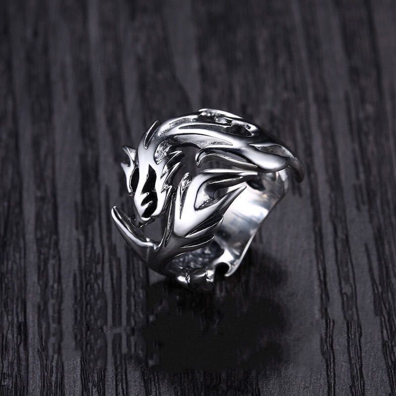 A Dragon Silver Ring by Maramalive™ with a dragon on it.