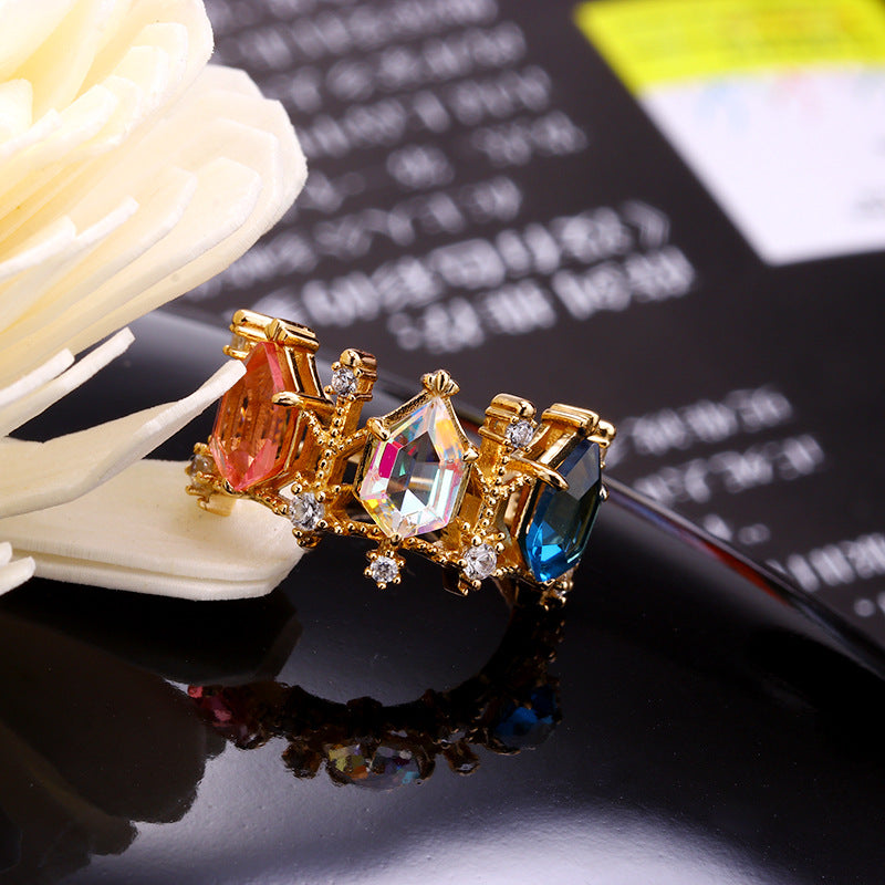A Maramalive™ Aurora Crystal Lamp Ring with multi colored stones.
