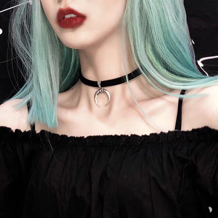 A woman wearing a Crystal Lace Gothic Necklace by Maramalive™.