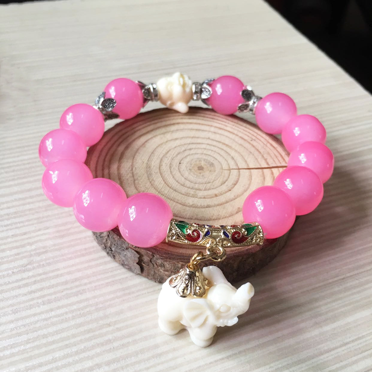 A Crystal Elephant Charm Bracelet with an elephant charm on it by Maramalive™.