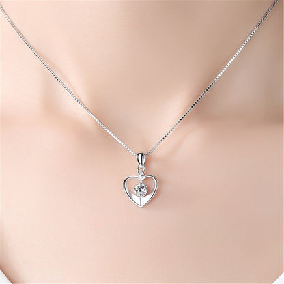 A Maramalive™ Heart Pendant Necklace Simple Couple Clavicle Chain with a diamond in the center.