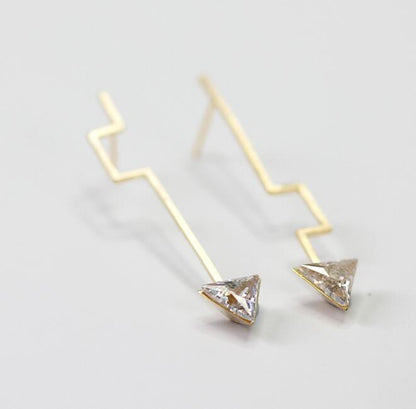 A pair of Modern Minimalist Dangle Earrings by Maramalive™ with a diamond in the middle.