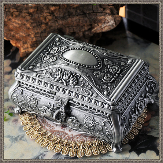 An ornate Vintage jewelry box by Maramalive™ on a table.