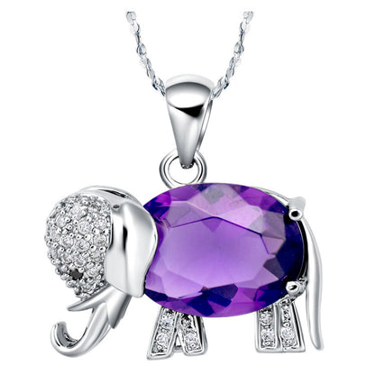 Four different colored crystal elephant pendants on a silver chain from Maramalive™.