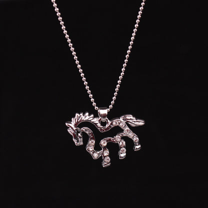 A Maramalive™ silver necklace with a hollow horse with diamonds on it.