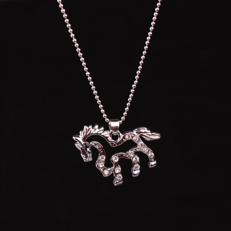 A Maramalive™ silver necklace with a hollow horse with diamonds on it.