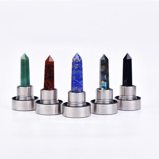 A group of different colored CJ Natural hexagonal crystal column energy glass creative water cups spa tea cups water cup crystal column magic wands next to each other.