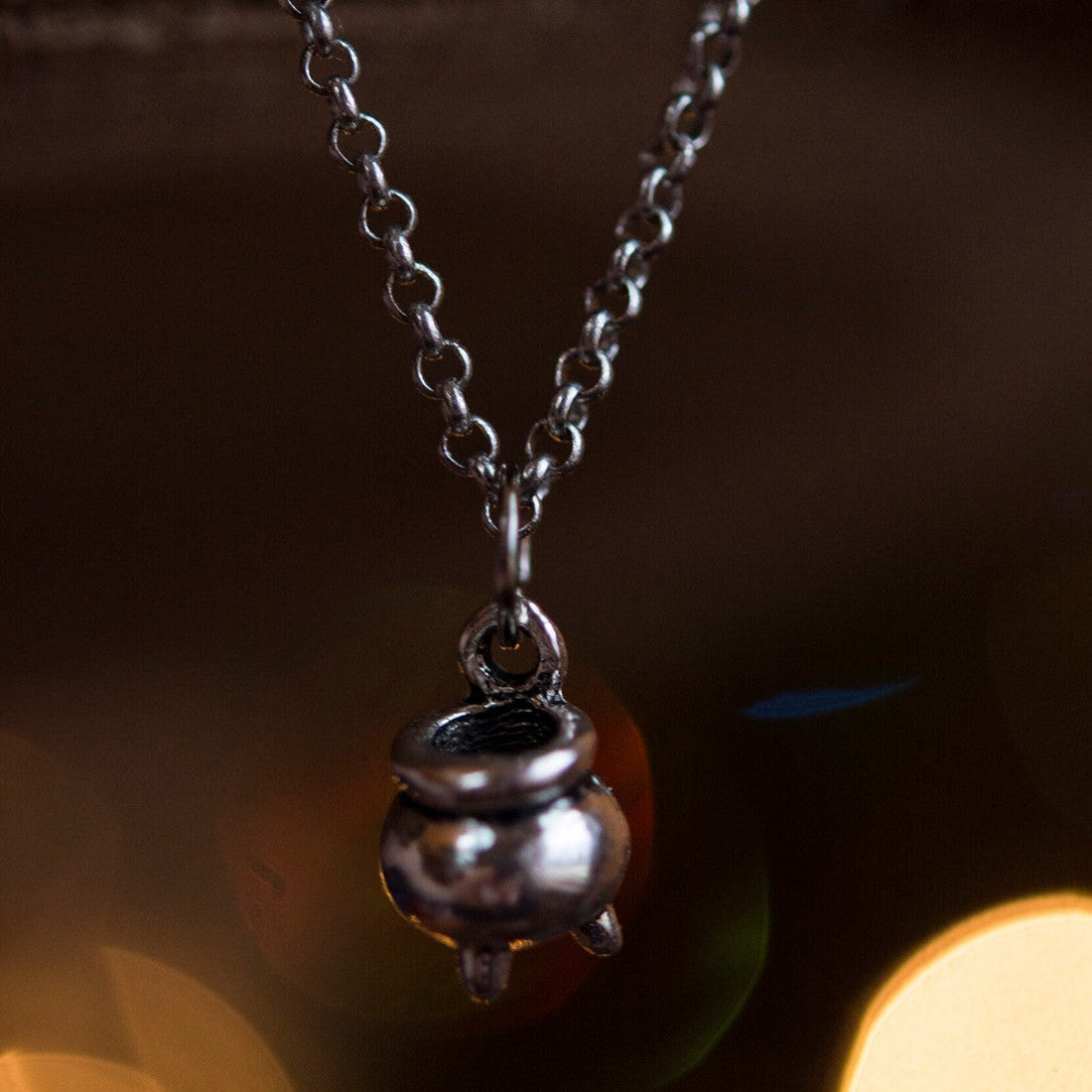 A small silver pot hanging on a chain is the Halloween Jewelry Halloween Wizard Pendant by Maramalive™.