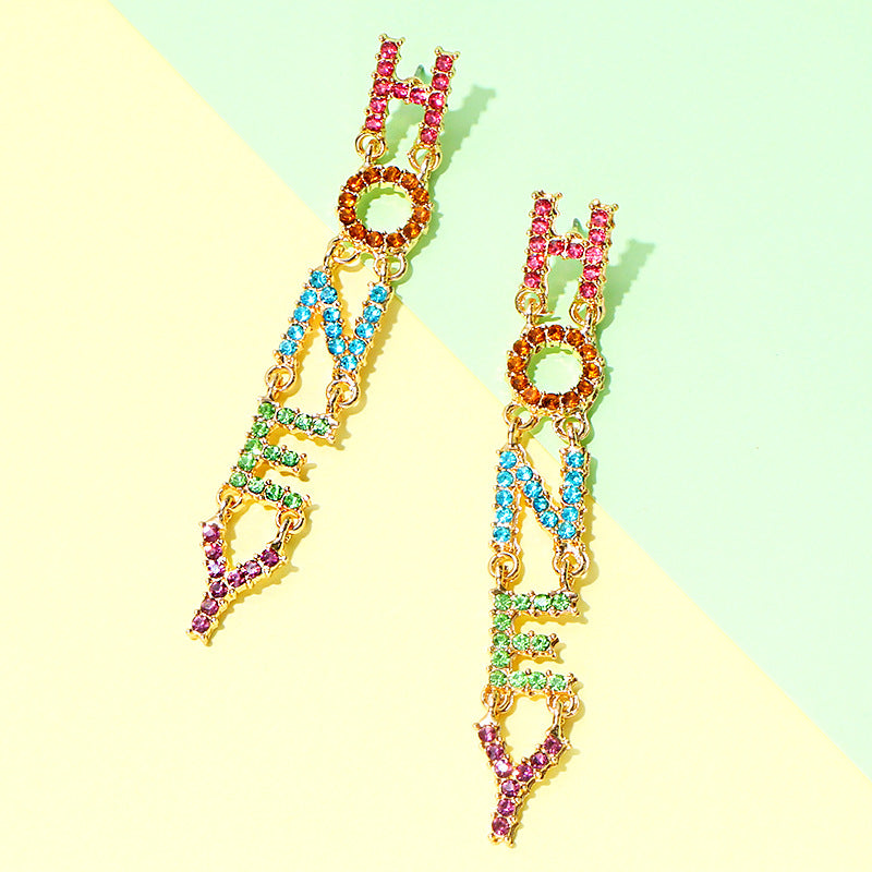 A pair of Maramalive™ Diamond Long Earrings with the word honey on them.